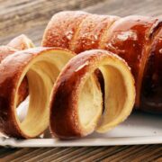 Chimney Cake Magic: Experience the Irresistible Delight of Kürtőskalács! Discover the top destinations to savor this delectable treat.