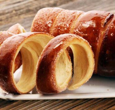Chimney Cake Magic: Experience the Irresistible Delight of Kürtőskalács! Discover the top destinations to savor this delectable treat.