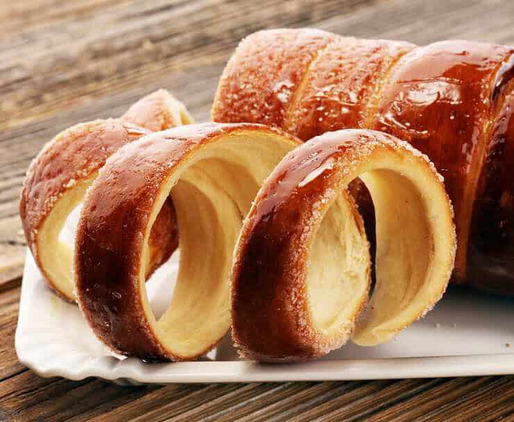 Chimney Cake Magic: Experience the Irresistible Delight of Kürtőskalács! Discover the top destinations to savor this delectable treat.